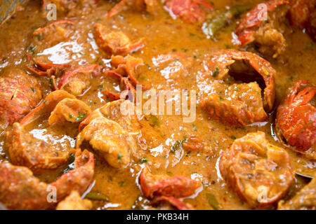 A close up of a spicy seafood or crayfish curry to be served with authentic Indian rice, The crayfish boiled, de-veined and prepared as curry gravy Stock Photo