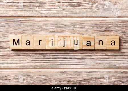 Marijuana word written on wood block. Marijuana text on table, concept. Stock Photo