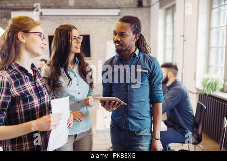 Portrait of young architects discussing in office Stock Photo