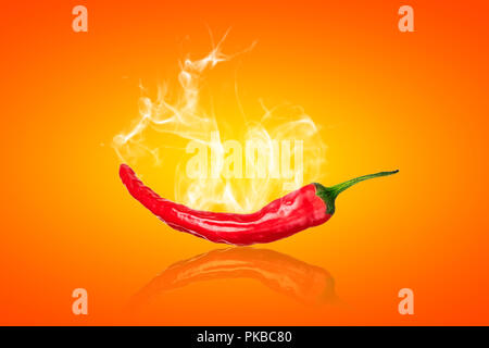 single red chili peppers  with white smoke on orange background Stock Photo