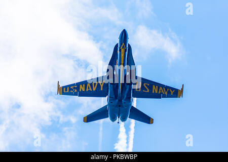 One of the F/A-18 Hornet fighter jets of The Blue Angels, flies low over Grand Traverse Bay, Traverse City, Michigan. Stock Photo