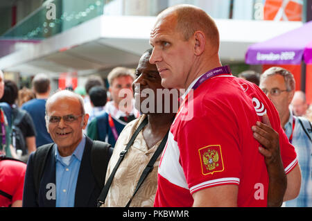 Alexander Karelin, (Aleksandr Karelin), retired greatest Russian Greco-Roman wrestler, with a fan at the London Olympic Park 2012, England UK Stock Photo