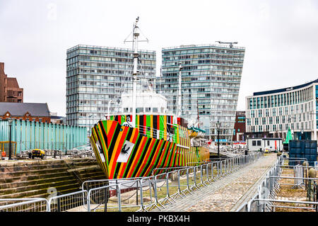 A 'dazzle' ship, The Edmund Gardner, in decoy confusing camouflage colours in dry dock in Liverpool, England, UK landscape Stock Photo