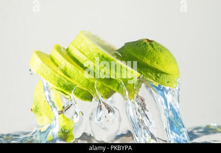 Fresh lime coming out from water. Suitable for advertisement. Stock Photo