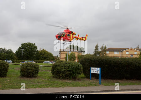 An MD902 Explorer owned and operated by Essex and Herts Air Ambulance landing at Colchester General Hospital with a casualty on board. Stock Photo