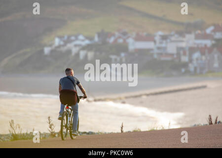 North Wales, 12th September 2018. UK Weather: After a night of heavy rain cooler fresher conditions fall in behind as the weather front moves southwards. Cooler fresher conditions on the coastal promenade of Llandudno in North Wales © DGDImages/AlamyNews Stock Photo