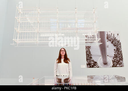 London, UK.  12 September 2018.  A staff member views a design for the Centre Georges Pompidou in Paris, France, at a preview of 'Renzo Piano: The Art of Making Buildings', an exhibition of works by the internationally renowned architect and Honorary Royal Academician Renzo Piano.  An overview of 16 of his most significant projects are on display in an exhibition which runs 15 September to 20 January 2019 at the Royal Academy of Arts in Piccadilly.  Credit: Stephen Chung / Alamy Live News Stock Photo