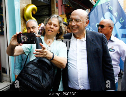 SÃO PAULO, SP - 12.09.2018: MEIRELLES E SKAF FAZEM CAMPANHA 25 MARÇO - The candidate for the presidency of the Republic, Henrique Meirelles 9MDB) and candidate for the government of the State of São Paulo, Paulo Skaf (MDB), walk in the street March 25, central region of the city, this morning (12) . (Photo: Aloisio Mauricio/Fotoarena) Stock Photo