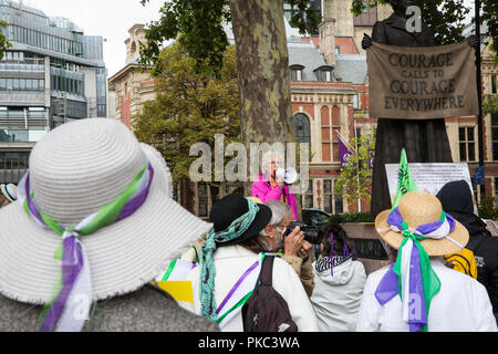 London, UK. 12th September, 2018. Ruth London of Fuel Poverty Action addresses women from across the UK and their supporters at a 100Women rally next to the statue of Millicent Fawcett in Parliament Square to honour the Suffragettes and to draw attention to the lack of democracy in overturning local votes against fracking. Credit: Mark Kerrison/Alamy Live News Stock Photo