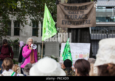 London, UK. 12th September, 2018. Ruth London from Fuel Poverty Action addresses women from across the UK and their supporters at a 100Women rally next to the statue of Millicent Fawcett in Parliament Square to honour the Suffragettes and to draw attention to the lack of democracy in overturning local votes against fracking. Credit: Mark Kerrison/Alamy Live News Stock Photo