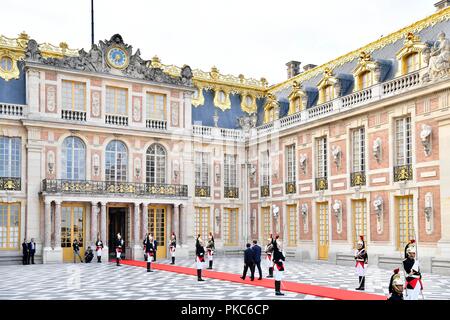 Versailles, France. 12th Sep, 2018. French President Emmanuel Macron (C-R) walks with visiting Japan's Crown Prince Naruhito (C-L) at Palace of Versailles in Versailles, France, on Sept. 12, 2018. Credit: Jack Chan/Xinhua/Alamy Live News Stock Photo