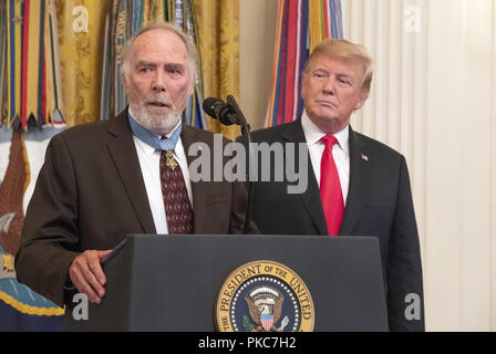 Washington, District of Columbia, USA. 12th Sep, 2018. United States Army Major Drew Dix (retired) a Congressional Medal of Honor recipient for heroism in the Vietnam War makes remarks at the Congressional Medal of Honor Society Reception as US President Donald J. Trump looks on from the right in the East Room of the White House in Washington, DC on Wednesday, September 12, 2018. Dix also serves as president of the Congressional Medal of Honor Society Credit: Ron Sachs/CNP/ZUMA Wire/Alamy Live News Stock Photo