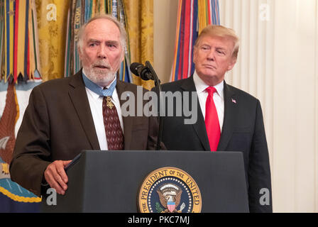 United States Army Major Drew Dix (retired) a Congressional Medal of Honor recipient for heroism in the Vietnam War makes remarks at the Congressional Medal of Honor Society Reception as US President Donald J. Trump looks on from the right in the East Room of the White House in Washington, DC on Wednesday, September 12, 2018. Dix also serves as president of the Congressional Medal of Honor Society. Credit: Ron Sachs/CNP | usage worldwide Stock Photo