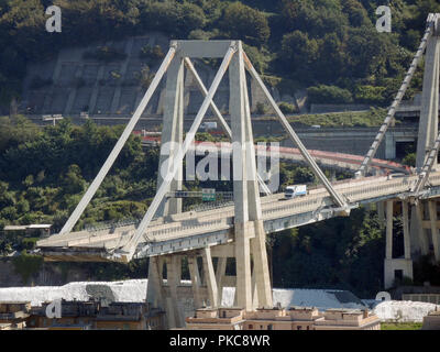 Genoa, Italy. 11th Sep, 2018. 11 September 2018, Italy, Genoa: View of the remains of the Morandi Bridge, which collapsed on 14 August at about 180 metres. 43 people were killed. (on dpa 'Genoa's Silent Wound' of 13.09.2018) Credit: Lena Klimkeit/dpa/Alamy Live News Stock Photo