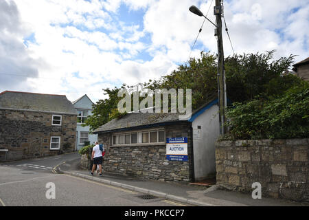 Newlyn, Cornwall, UK. 13th September 2018. This ex public toilet block, from Cornwall council, is up for aucution reportedly for £15k today. It has views towards Newlyn harbour and the sea. Credit: Simon Maycock/Alamy Live News Stock Photo
