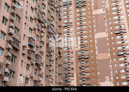 Large apartment house. Air conditioners hang on a wall. Stock Photo