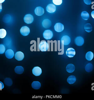 Bright blurred blue lights on black background Stock Photo