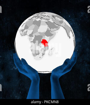 Tanzania In red on white globe held in hands in space. 3D illustration. Stock Photo