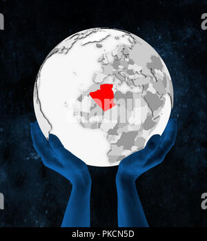 Algeria In red on white globe held in hands in space. 3D illustration. Stock Photo