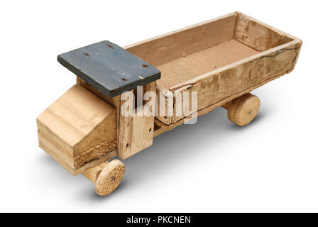 Isolated objects: very old handmade wooden toy, generic auto truck on white background, closeup shot Stock Photo