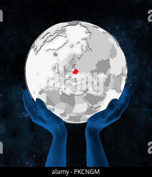 Belarus In red on white globe held in hands in space. 3D illustration. Stock Photo