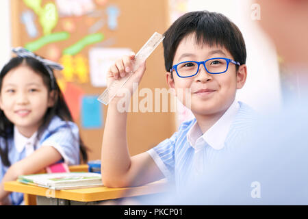 Elementary school students in the classroom Stock Photo