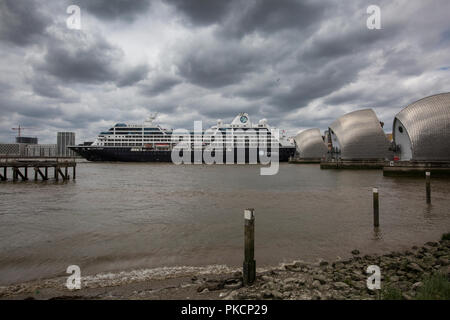 Azamara Cruise ship passes through the Thames Barrier, movable flood barrier situated on the River Thames in South East London, England, UK Stock Photo