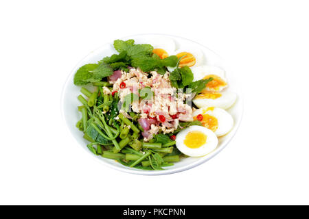 Isolated of Spicy Chinese morning glory salad with boiled egg topped pork chops is popular Thai food. Stock Photo