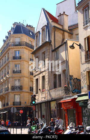 PARIS - AUGUST 28 : Sunny parisian street with old beautiful facades on 28th August 2012 in Paris, France. Paris is the most touristic city in the wor Stock Photo