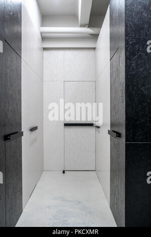 Illuminated interior in loft style with textured walls Stock Photo
