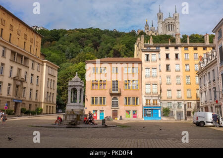 Place Saint-Jean, with the basilica of Notre dame of Fourviere in the background, Lyon, France Stock Photo