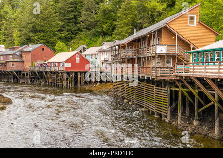 Some of the old timber houses in Creek Street built on stilts above the Ketchikan Creek in downtown Ketchikan, Alaska USA Stock Photo