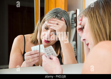 woman taking pills Stock Photo
