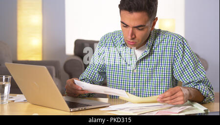 Man handling the bills Stock Photo