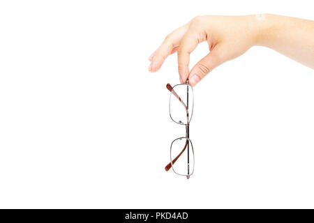 Female's hand holding glasse on white background. Glasses in hand. Isolated on white Stock Photo