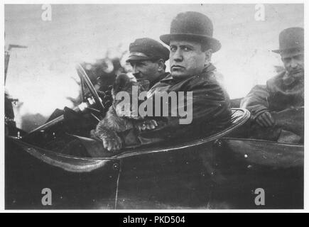 Benito Mussolini the Italian fascist leader in an open top car with his pet lion cub 'Ras' in 1924 after he became dictator of Italy Stock Photo
