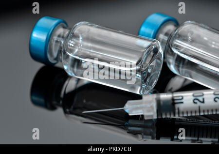 Tuberculin Syringe and Sterile Vial Filled with Medication Solution. An ...