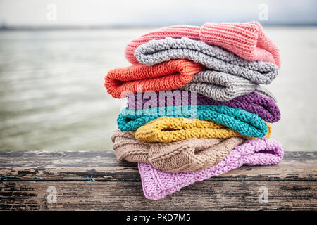 knitting pink crochet hooks and woolen thread on a blue background Stock  Photo - Alamy