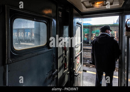Trans Siberian Express, Siberia, Russia - March 20, 2018: Train attendant is checking passengers before departure from Novosibirsk railway Station, Ru Stock Photo