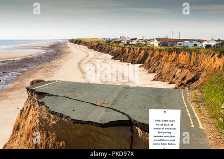 A collapsed coastal road between Skipsea and Ulrome on Yorkshire's East Coast, UK. The coast is composed of soft boulder clays, very vulnerable to coa Stock Photo