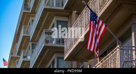 American Flag on the balcony of a building Stock Photo