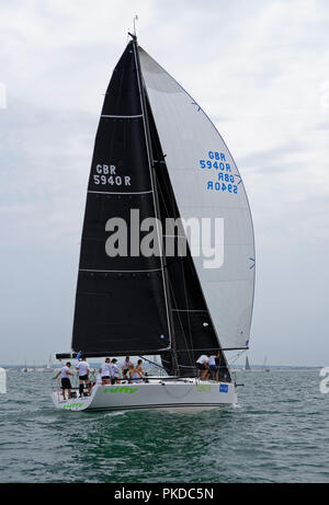 Racing Yacht GBR 5940R 'Nifty' competes during the Lendy Cowes Week Regatta held in the Solent off the south coast of Great Britain Stock Photo