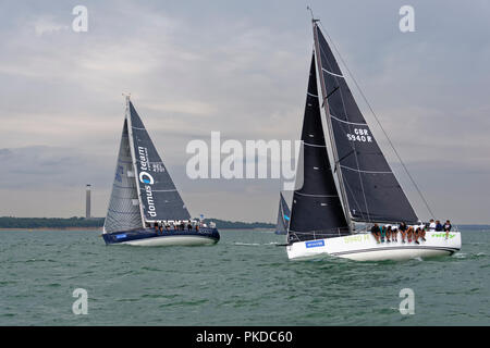 Close competition during the Cowes Week Regatta with these two yachts the Belgian Moana and British Nifty neck and neck in the Solent Stock Photo