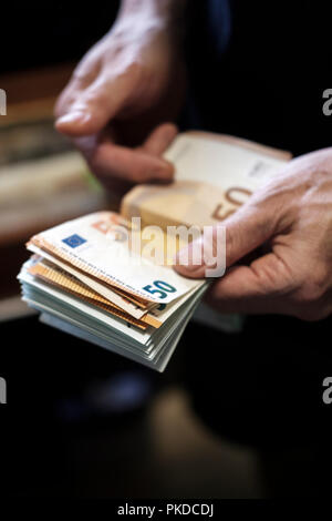 Counting cash-euro banknotes-fifty euros banknotes Stock Photo