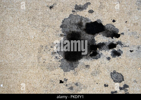 Motor oil stains on concrete pavement/texture background Stock Photo