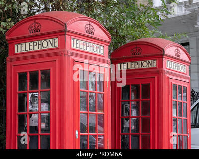 A pair of K2 red telephone boxes, the original design by Sir Giles Gilbert Scott in Regent's Park Stock Photo