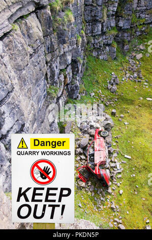 A car abandoned in a limestone quarry at Geltsdale North Cumbria UK Stock Photo