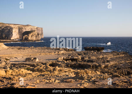 Mediterranean Sea Waves Crashing on Gozo Island Limestone Cliffs Stock Photo
