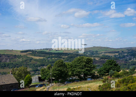 World War 2 Lancaster Bomber flying over Uppermill, Greater Manchester, UK. Stock Photo