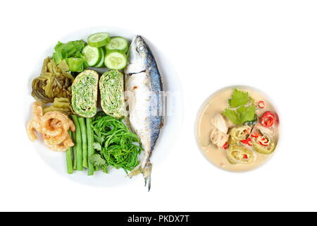 Coconut milk and fermented soy bean sauce call Toa Jiaw Loan in Thai and dish of deep fired mackarels,omelet,crispy pork rind,pickle lettuce,halve gre Stock Photo